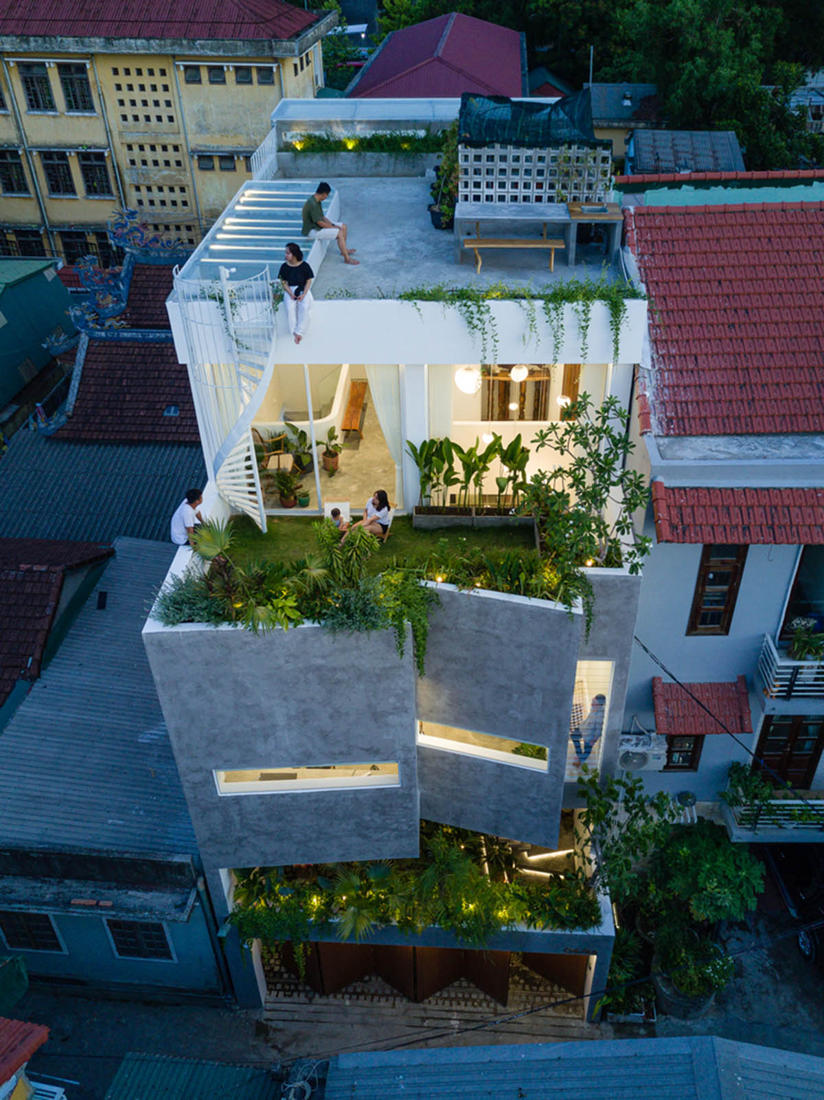 Jalousie House in Vietnam features porous wall with folding pattern for airy interior