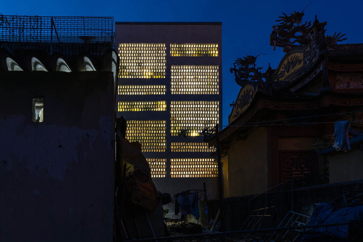 Jalousie House in Vietnam features porous wall with folding pattern for airy interior