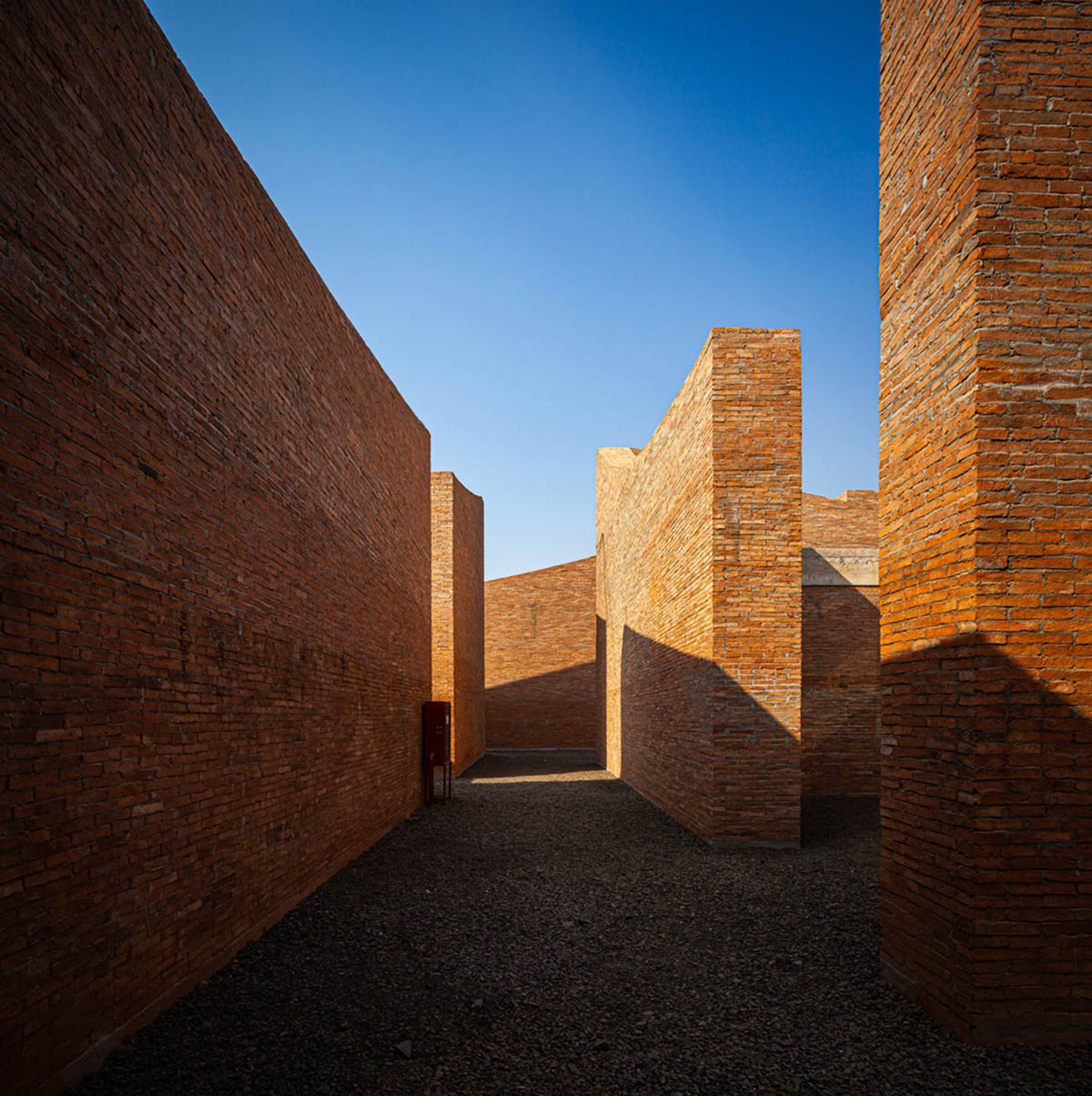 Bangkok Project Studio used over 480,0000 fired clay bricks to form elephant museum with curved walls