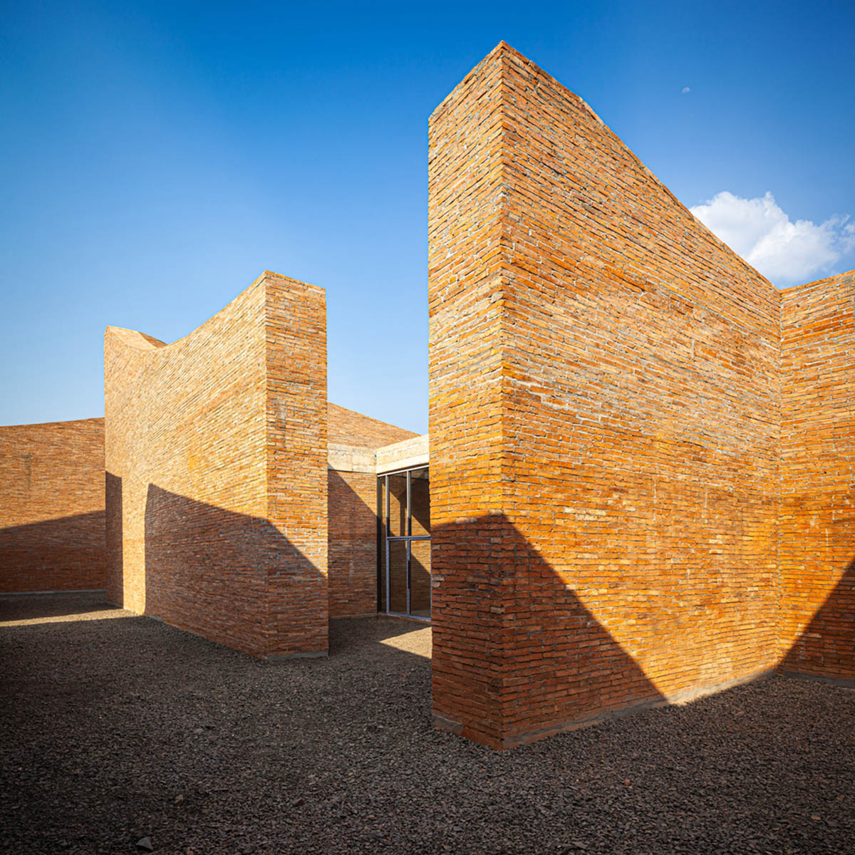 Bangkok Project Studio used over 480,0000 fired clay bricks to form elephant museum with curved walls
