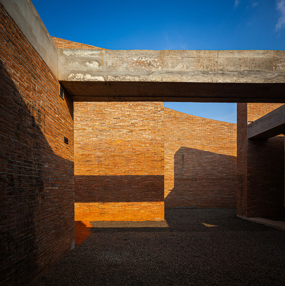 Bangkok Project Studio used over 480,0000 fired clay bricks to form elephant museum with curved walls