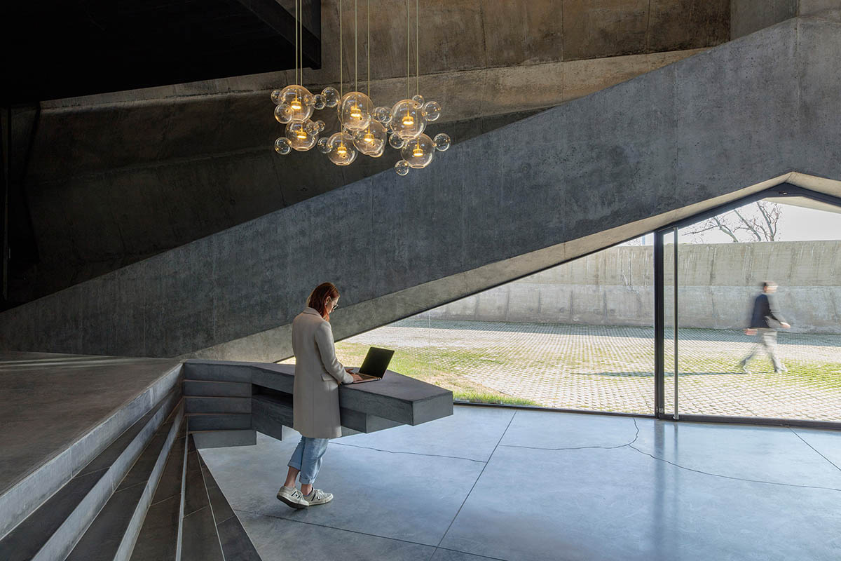 Folded concrete shell wraps coffee production plant by Giorgi Khmaladze Architects in Tbilisi