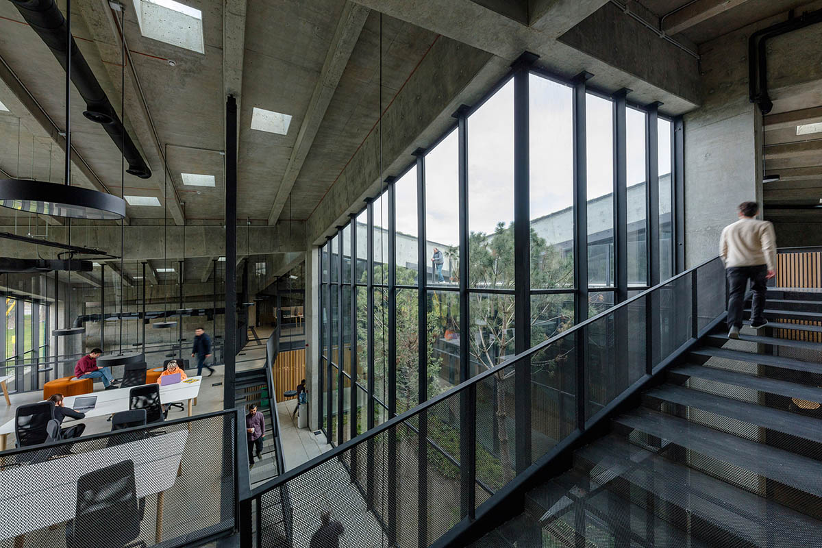 Folded concrete shell wraps coffee production plant by Giorgi Khmaladze Architects in Tbilisi