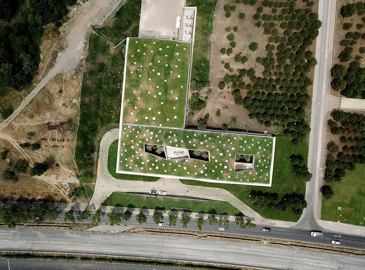 Folded concrete shell wraps coffee production plant by Giorgi Khmaladze Architects in Tbilisi