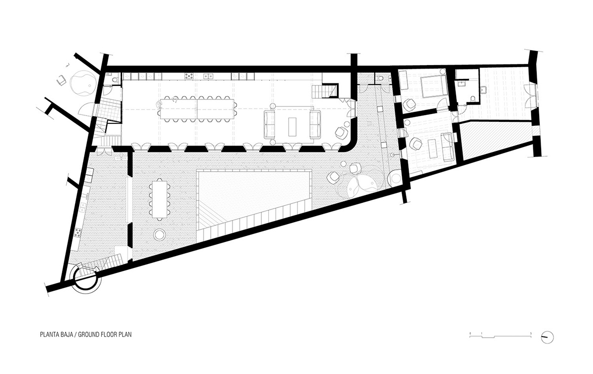 Anna & Eugeni Bach converts former chocolate factory into residence with stone walls in Spain