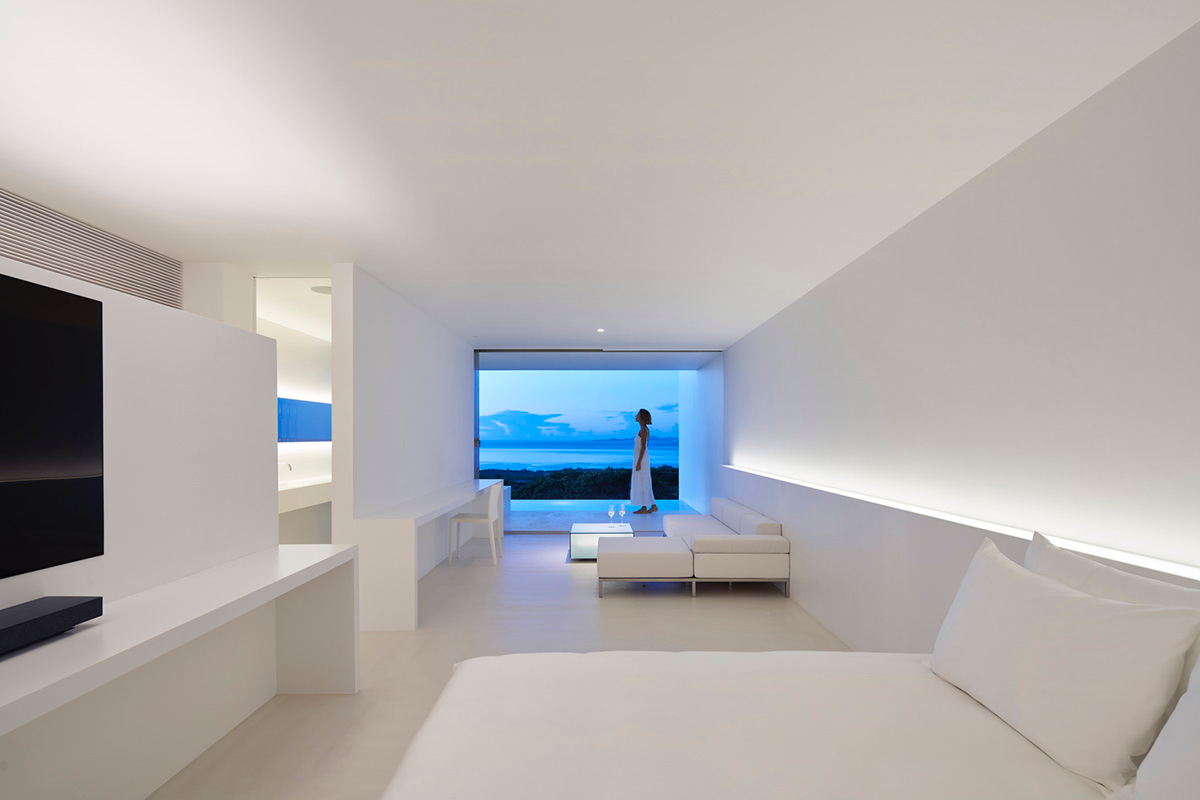 Shinichi Ogawa & Associates hides five guest rooms within all-white minimalist volume in Japan