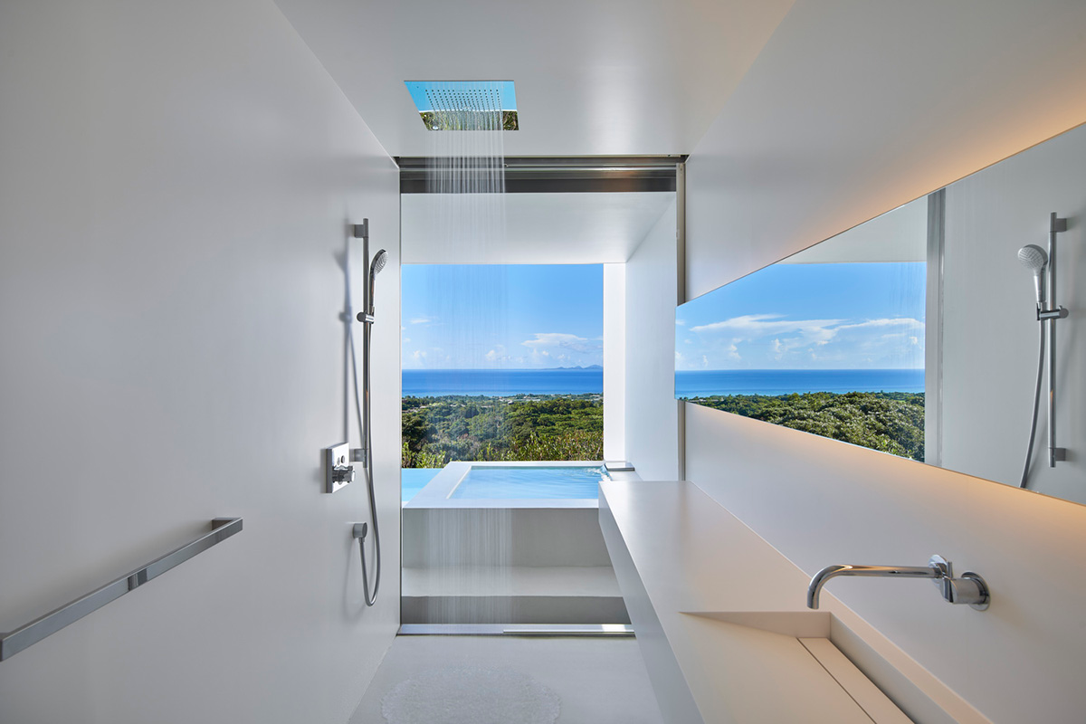 Shinichi Ogawa & Associates hides five guest rooms within all-white minimalist volume in Japan
