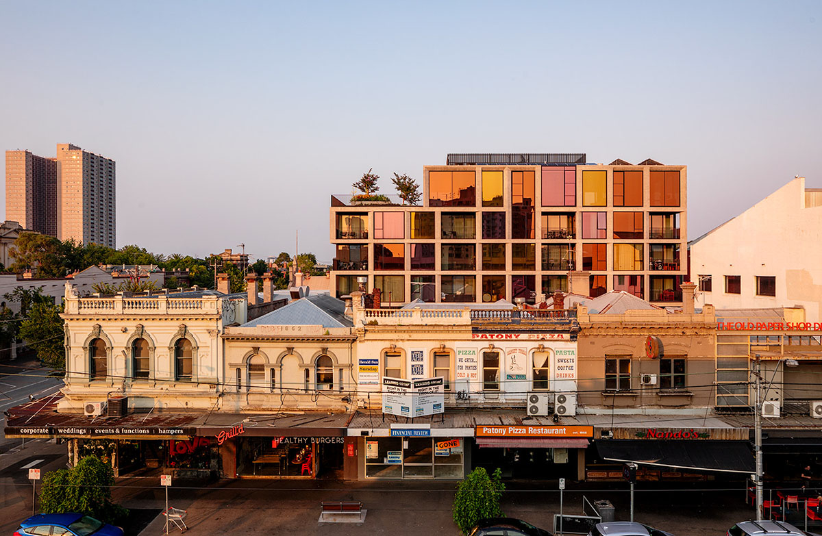 Piccolo House by Wood Marsh features coloured reflective glass elements in South Melbourne