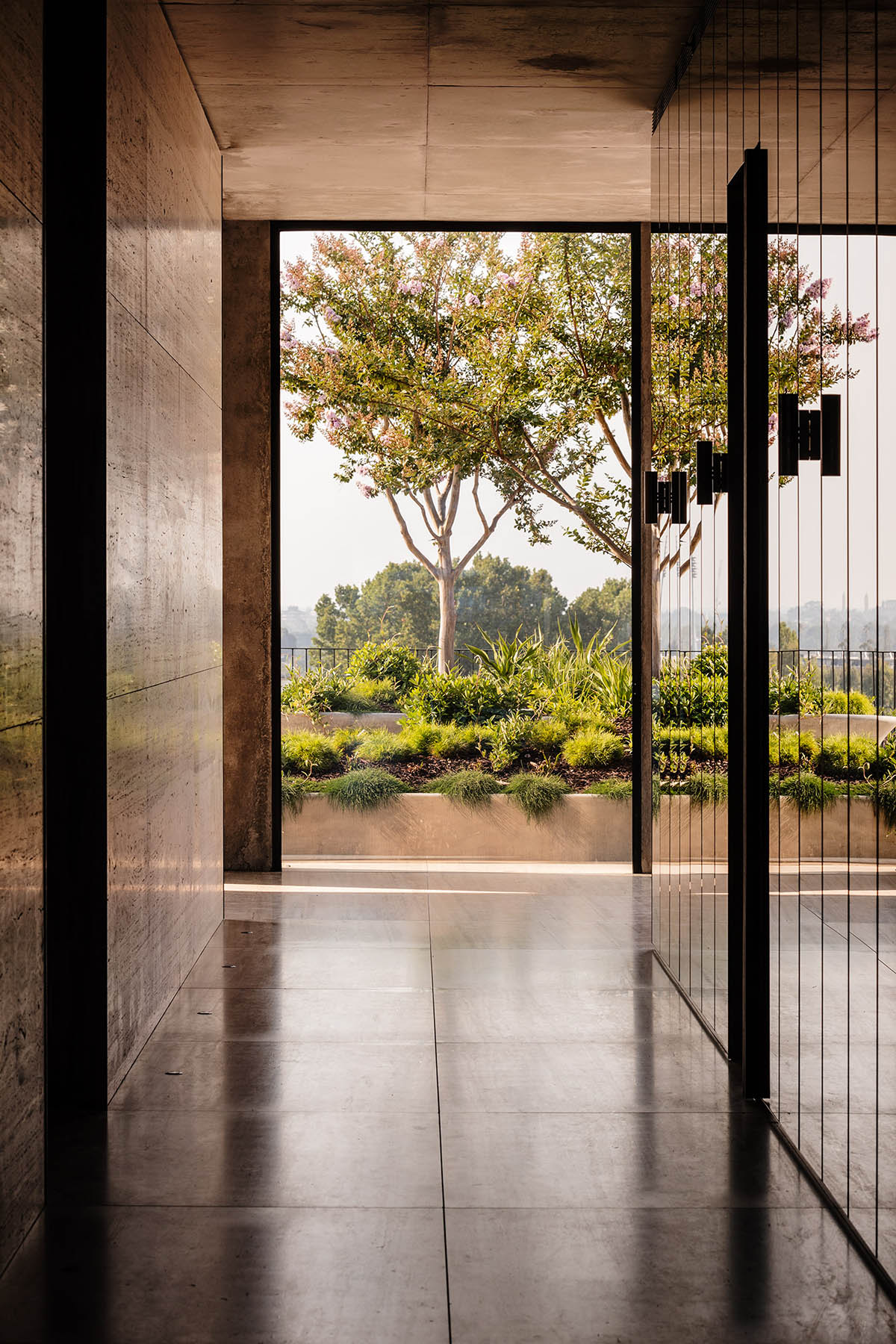 Piccolo House by Wood Marsh features coloured reflective glass elements in South Melbourne
