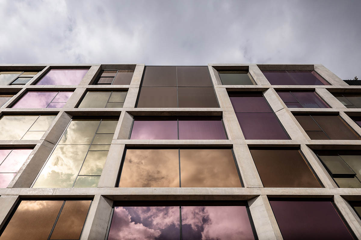Piccolo House by Wood Marsh features coloured reflective glass elements in South Melbourne