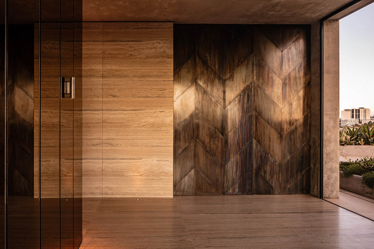 Piccolo House by Wood Marsh features coloured reflective glass elements in South Melbourne