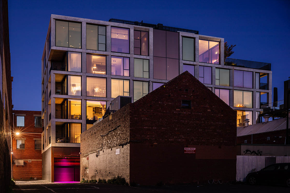 Piccolo House by Wood Marsh features coloured reflective glass elements in South Melbourne