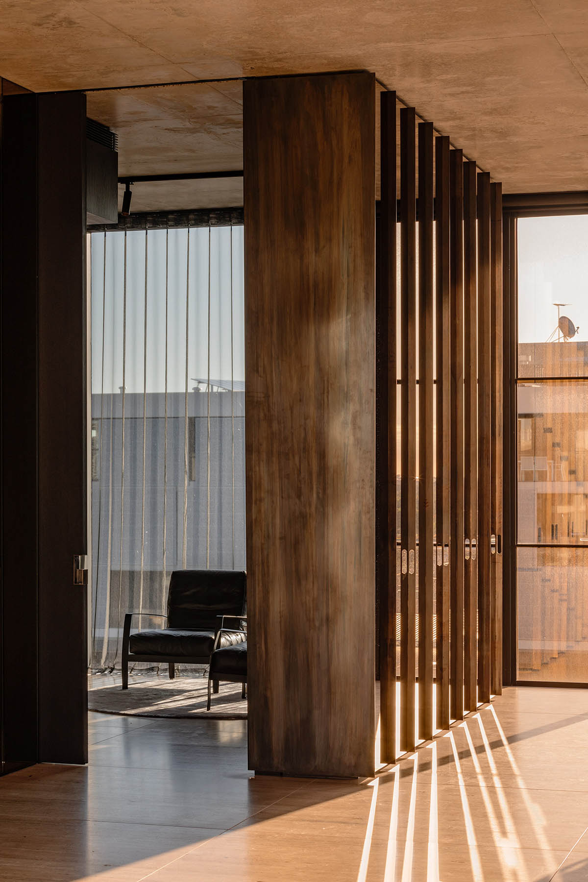 Piccolo House by Wood Marsh features coloured reflective glass elements in South Melbourne