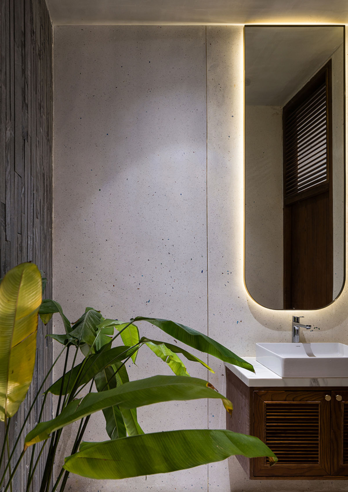 AD9 Architects built residence on a narrow plot with half-circled balconies in Vietnam