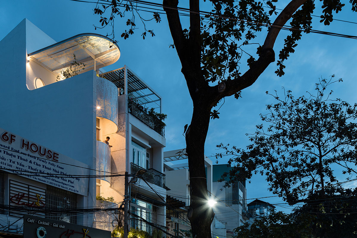 AD9 Architects built residence on a narrow plot with half-circled balconies in Vietnam