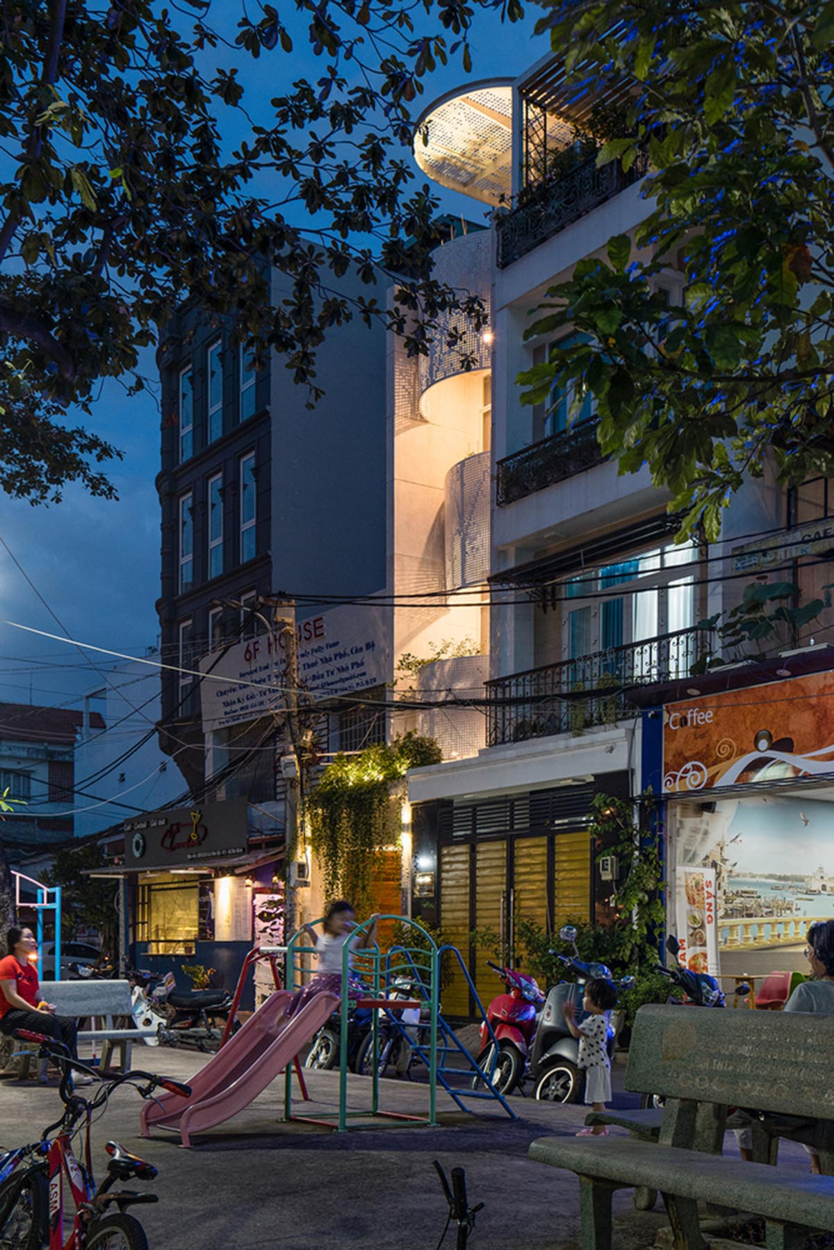 AD9 Architects built residence on a narrow plot with half-circled balconies in Vietnam