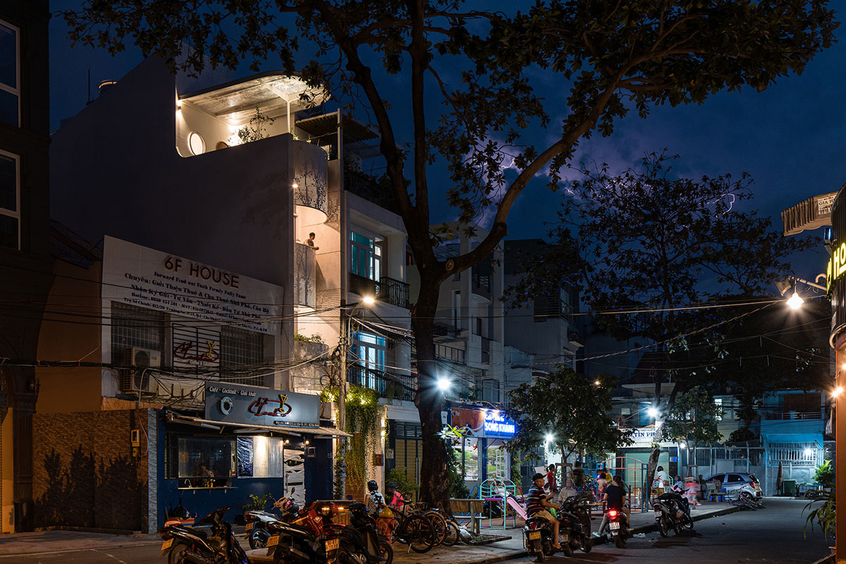 AD9 Architects built residence on a narrow plot with half-circled balconies in Vietnam