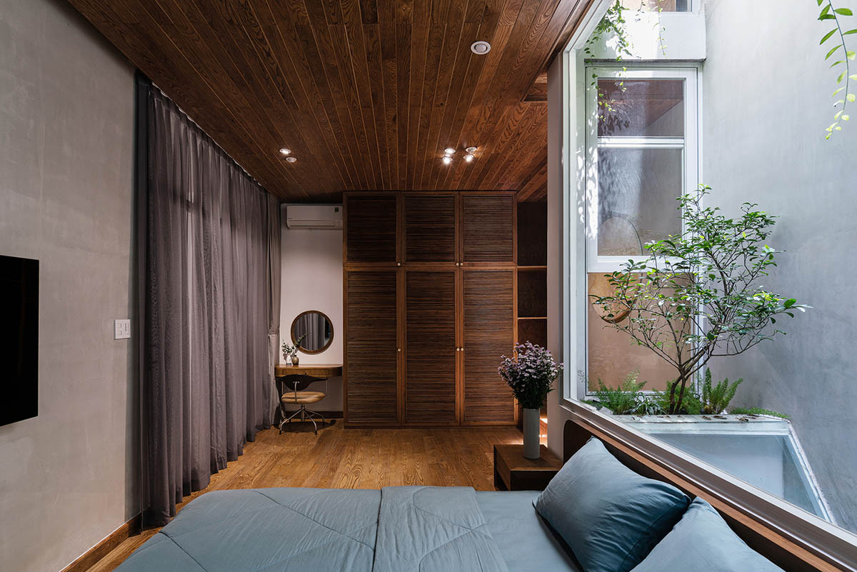 AD9 Architects built residence on a narrow plot with half-circled balconies in Vietnam