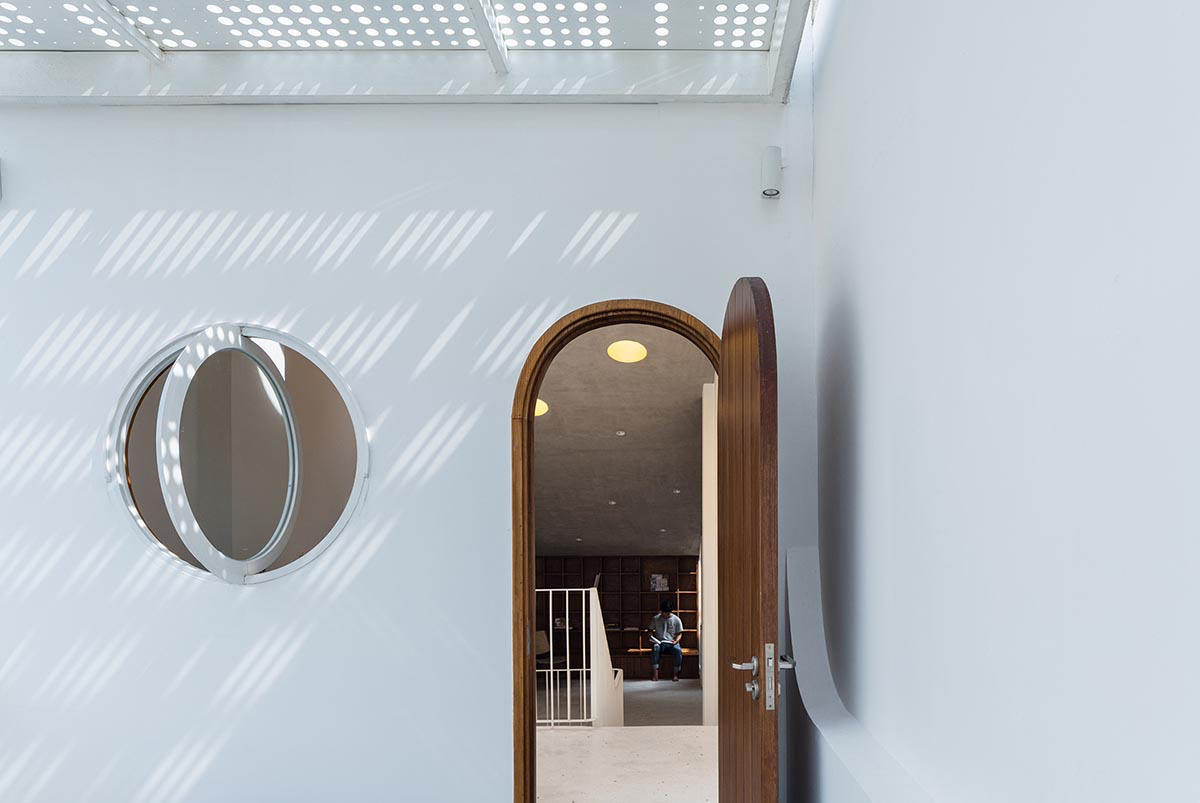 AD9 Architects built residence on a narrow plot with half-circled balconies in Vietnam