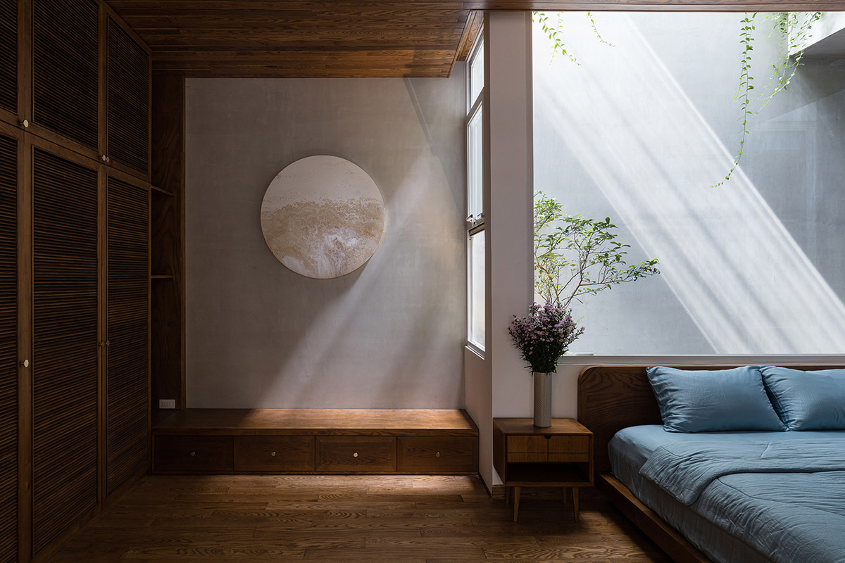 AD9 Architects built residence on a narrow plot with half-circled balconies in Vietnam