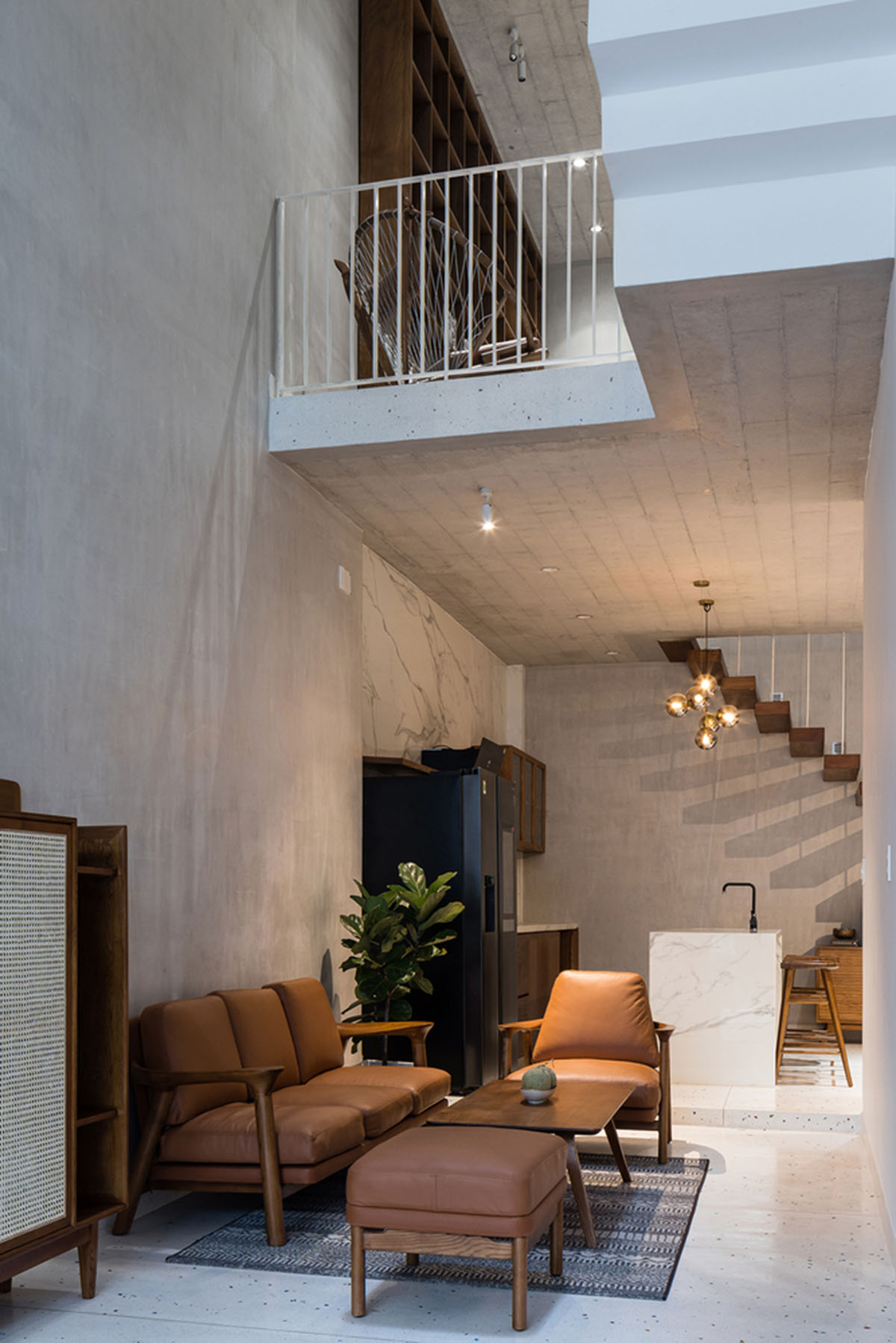 AD9 Architects built residence on a narrow plot with half-circled balconies in Vietnam