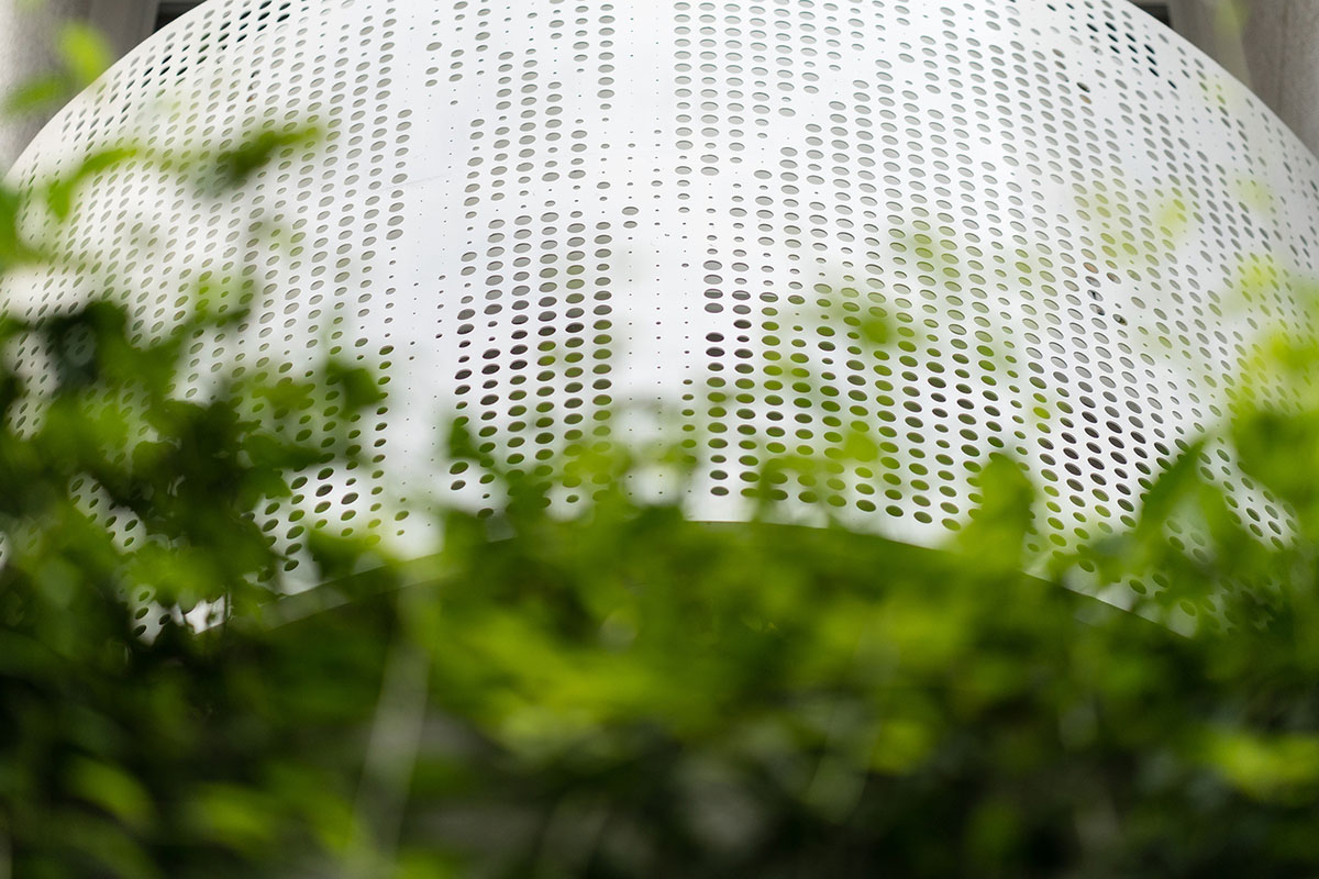 AD9 Architects built residence on a narrow plot with half-circled balconies in Vietnam