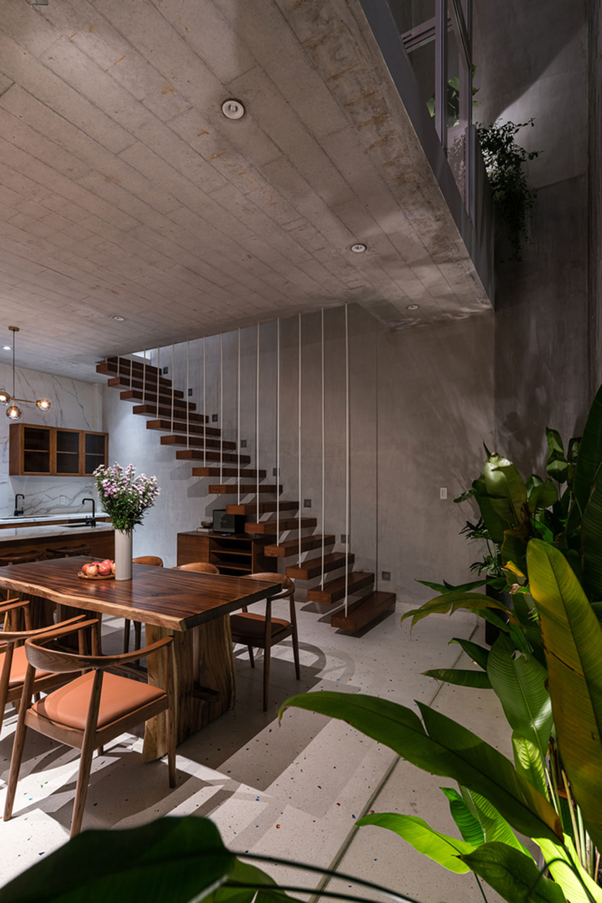 AD9 Architects built residence on a narrow plot with half-circled balconies in Vietnam