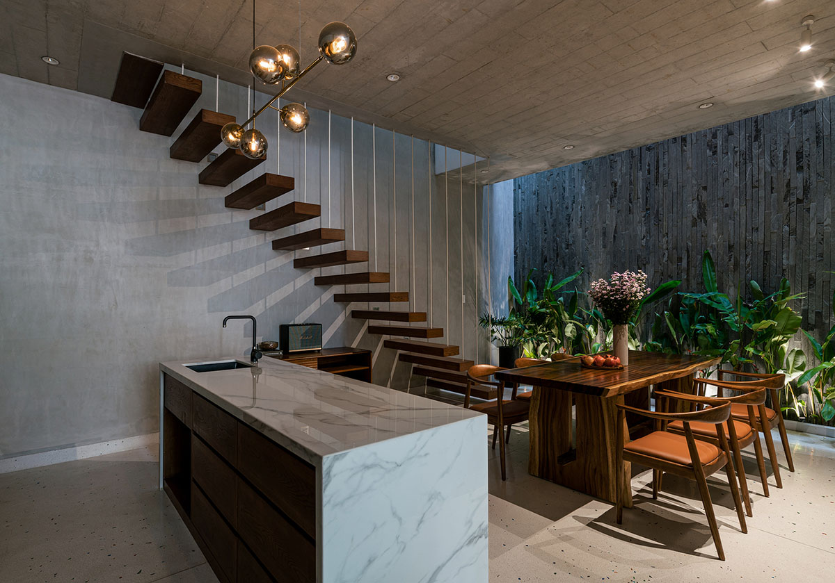 AD9 Architects built residence on a narrow plot with half-circled balconies in Vietnam