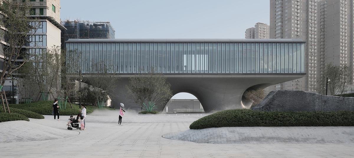 Community Center in Xi&rsquo;an is raised on sculptural base that features a rippling effect