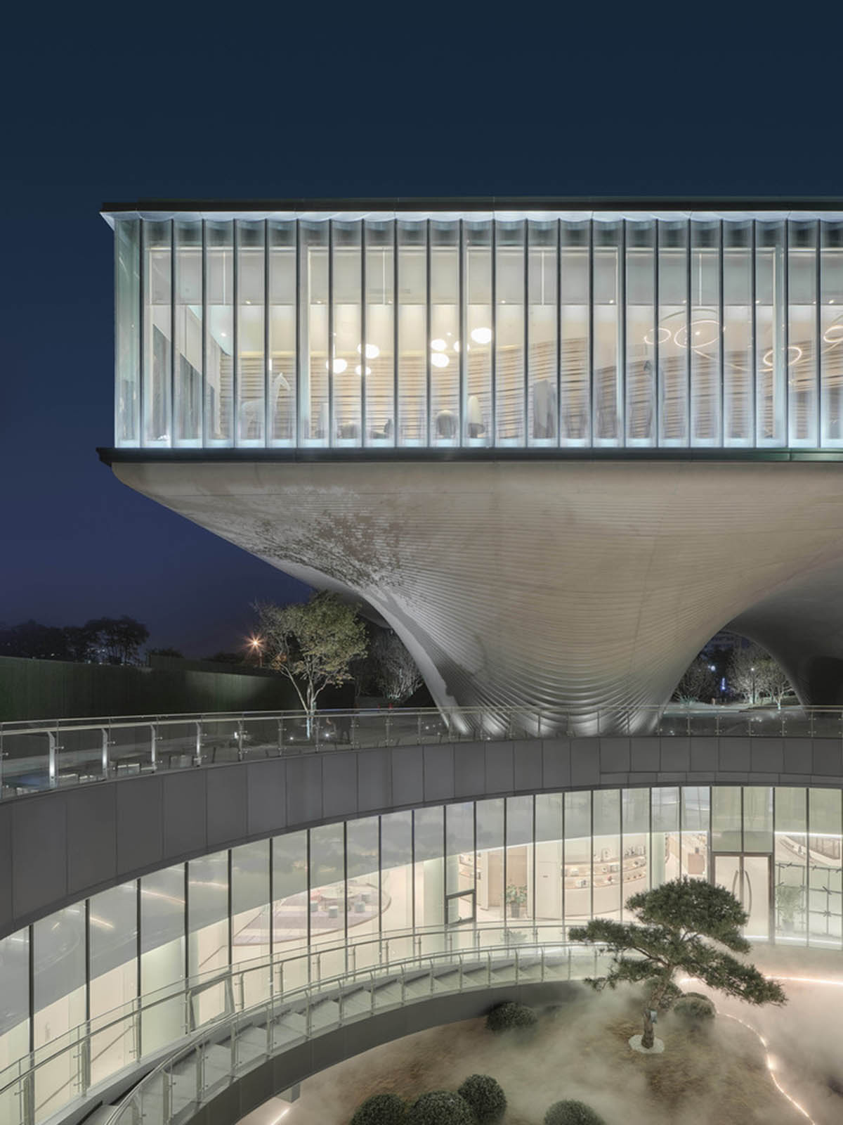 Community Center in Xi&rsquo;an is raised on sculptural base that features a rippling effect