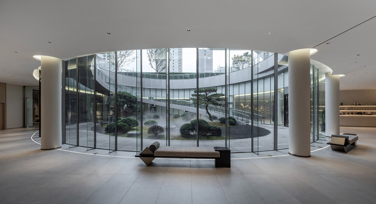 Community Center in Xi&rsquo;an is raised on sculptural base that features a rippling effect