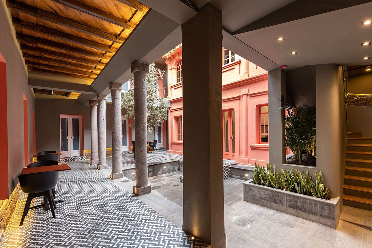 nicolas&nicolas converts old building into hotel with pinkish walls and central courtyard in Quito