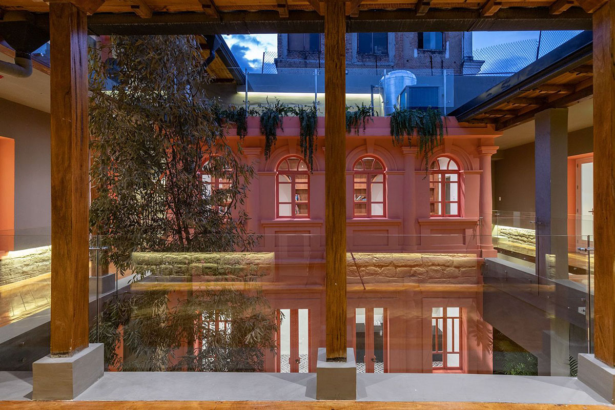 nicolas&nicolas converts old building into hotel with pinkish walls and central courtyard in Quito