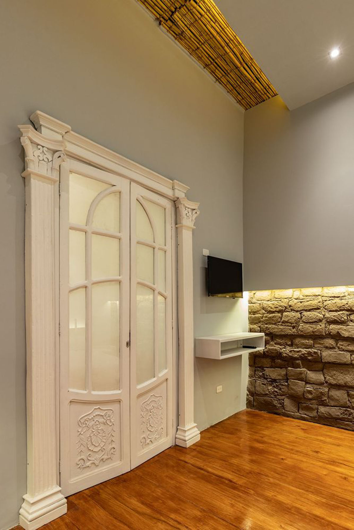 nicolas&nicolas converts old building into hotel with pinkish walls and central courtyard in Quito