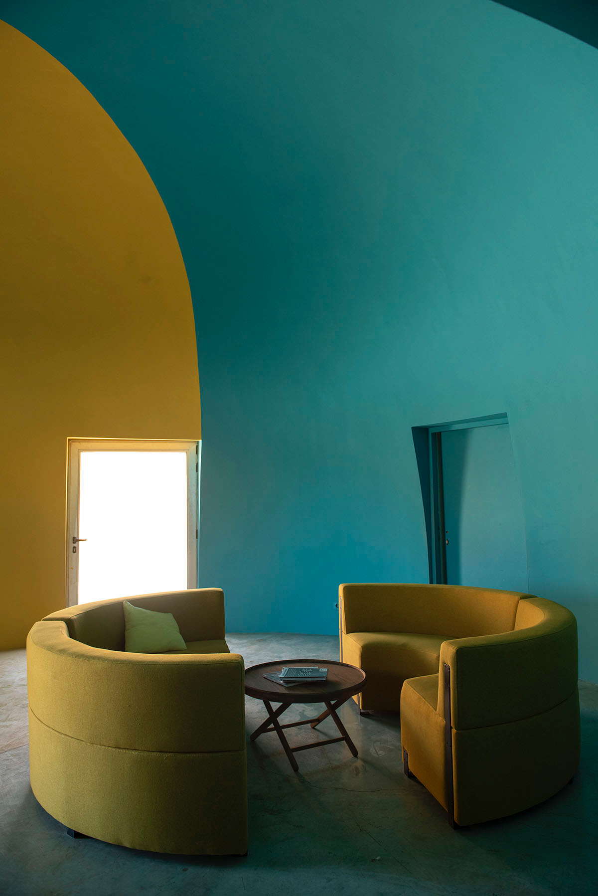 ZAV Architects built colorful-domed housing made of rammed earth and sand on Hormuz island, Iran
