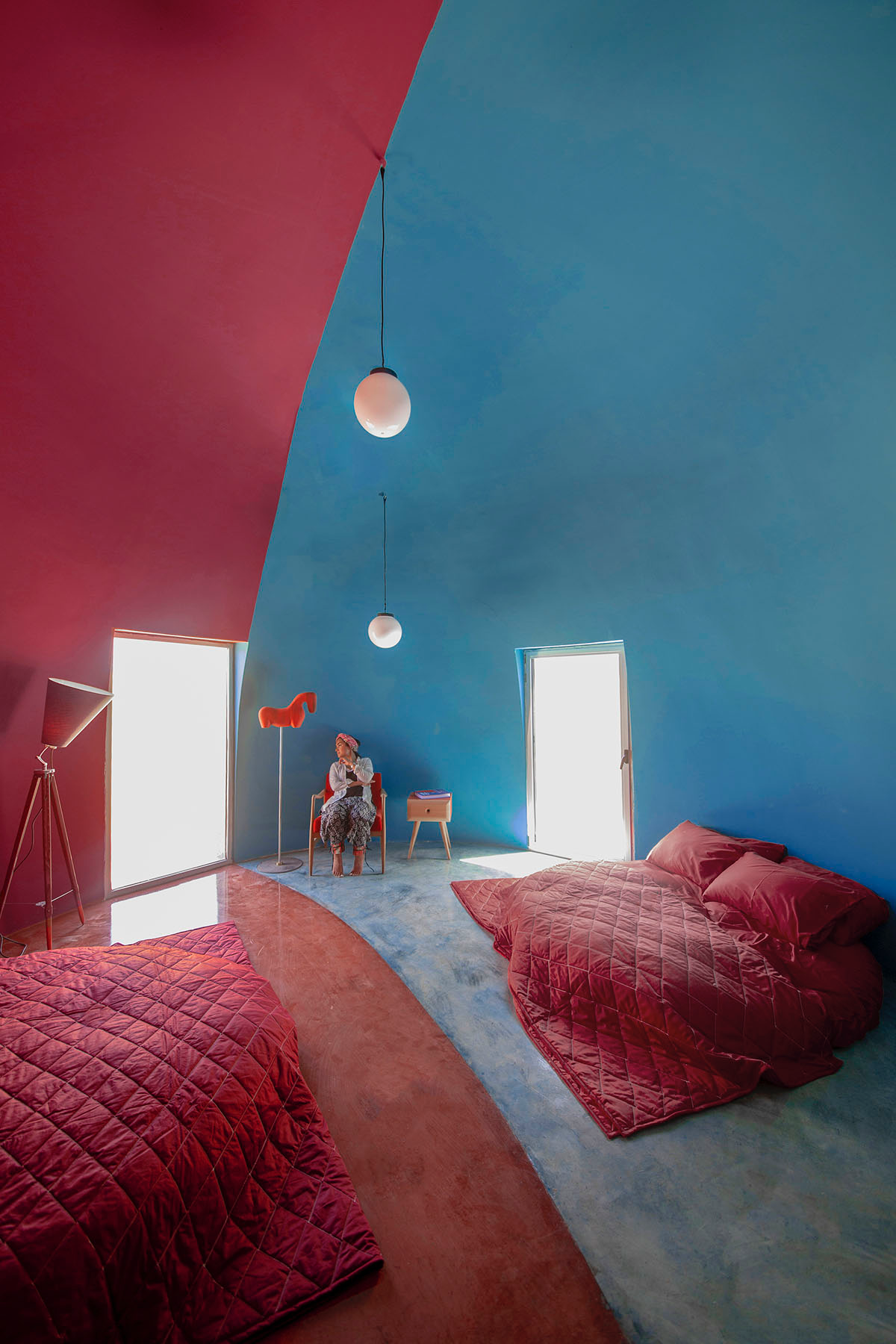 ZAV Architects built colorful-domed housing made of rammed earth and sand on Hormuz island, Iran