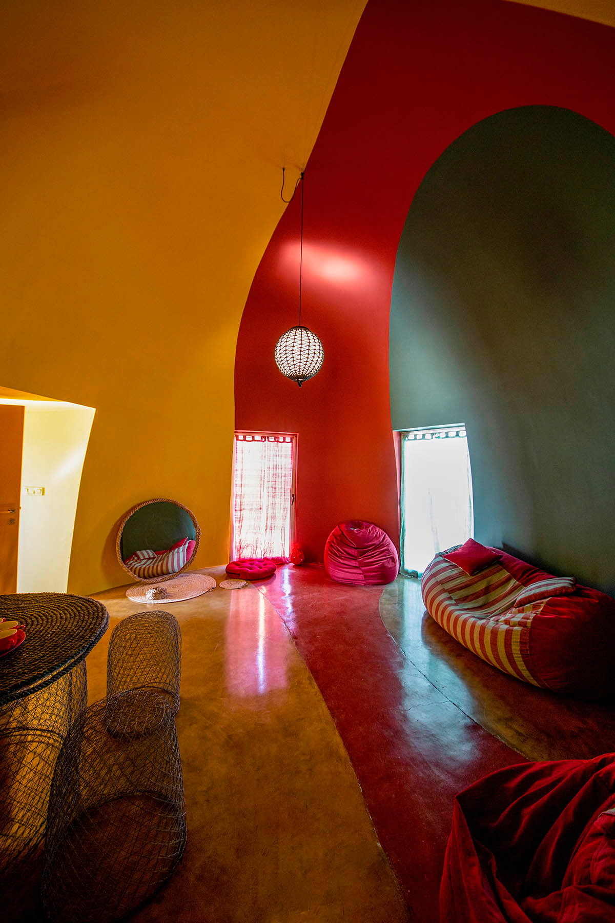 ZAV Architects built colorful-domed housing made of rammed earth and sand on Hormuz island, Iran