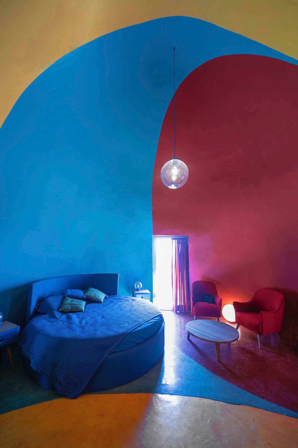 ZAV Architects built colorful-domed housing made of rammed earth and sand on Hormuz island, Iran