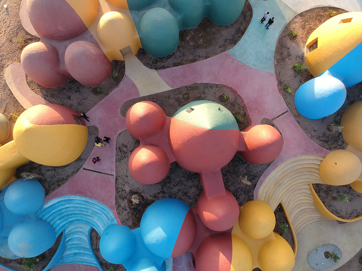 ZAV Architects built colorful-domed housing made of rammed earth and sand on Hormuz island, Iran