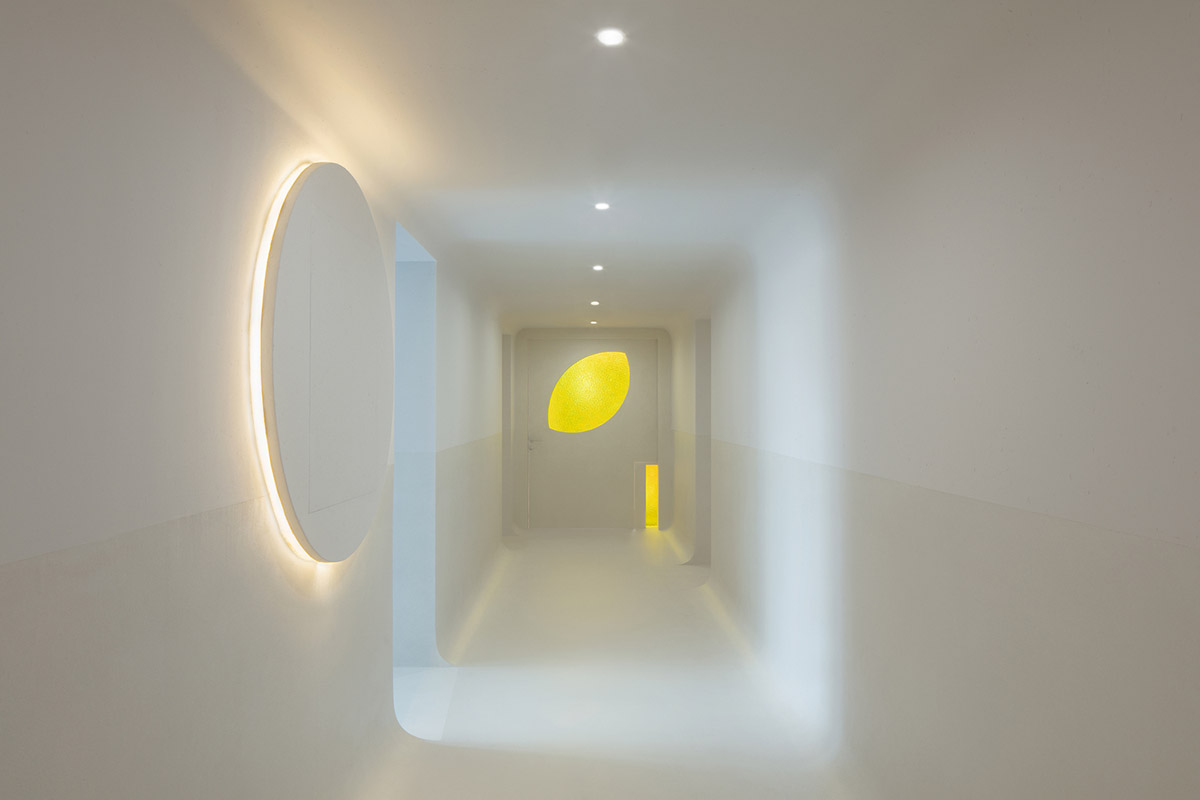 Jiejie studio wraps this tea room with a peach garden with rocky and forest landscape in Beijing