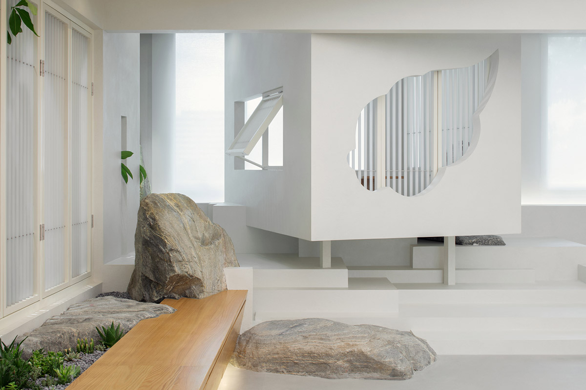 Jiejie studio wraps this tea room with a peach garden with rocky and forest landscape in Beijing