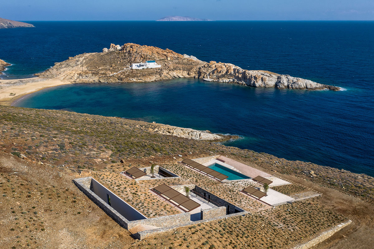 MOLD Architects used advantages of sloping land to design Ncaved house in Greece