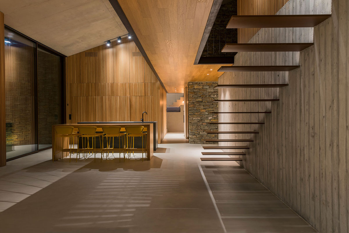 MOLD Architects used advantages of sloping land to design Ncaved house in Greece