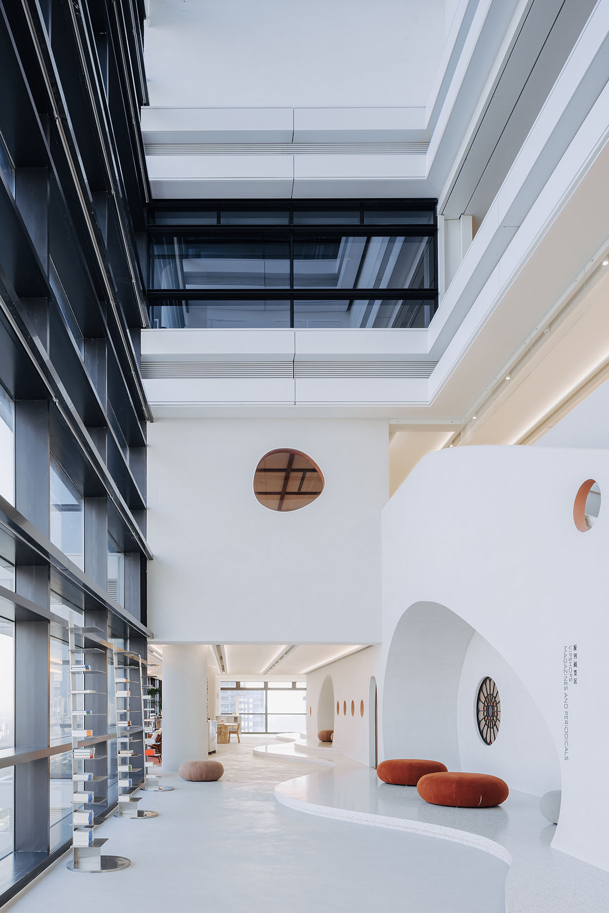 Wutopia Lab creates surprising interiors with cut-out forms in The Satori Harbor Library in Guangzhou