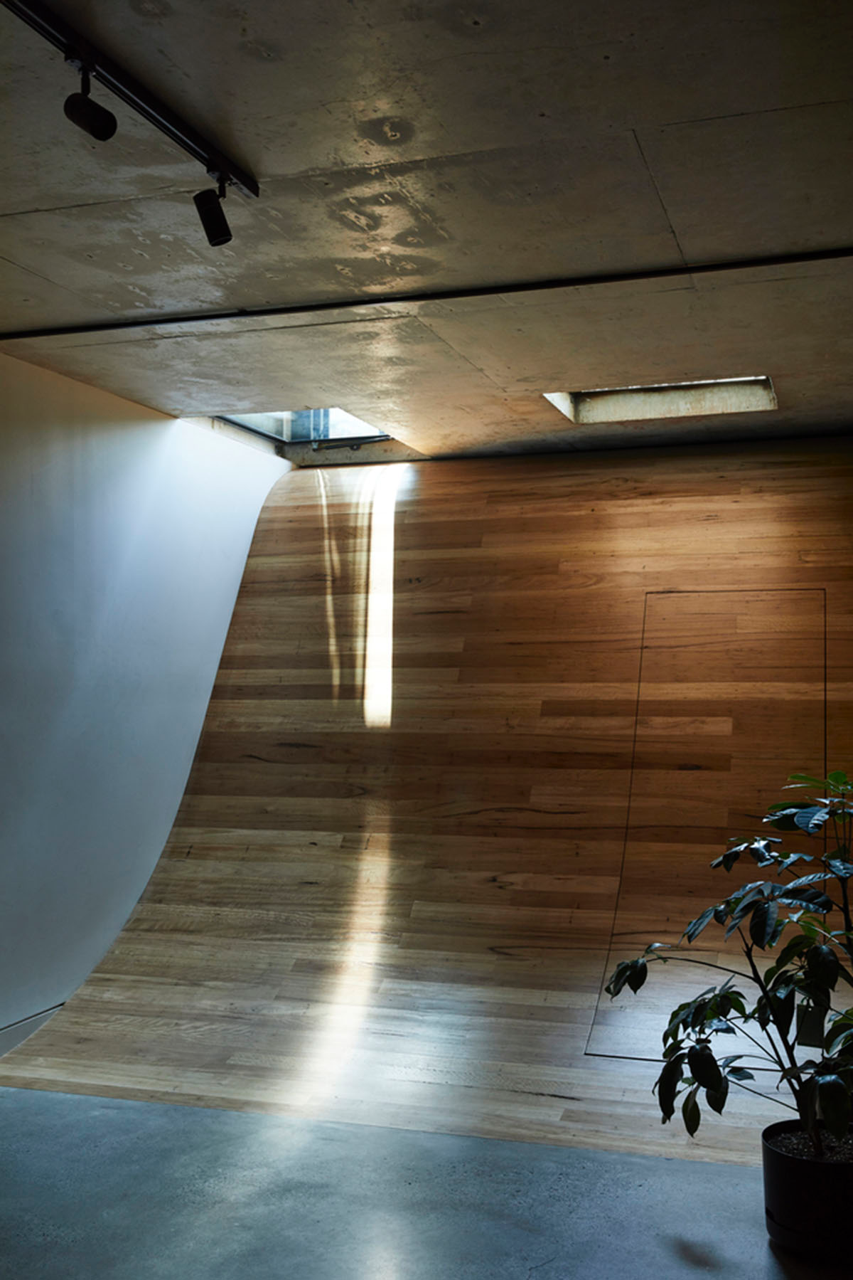 Austin Maynard Architects adds glass volume to the original Dutch-gabled facade in Melbourne