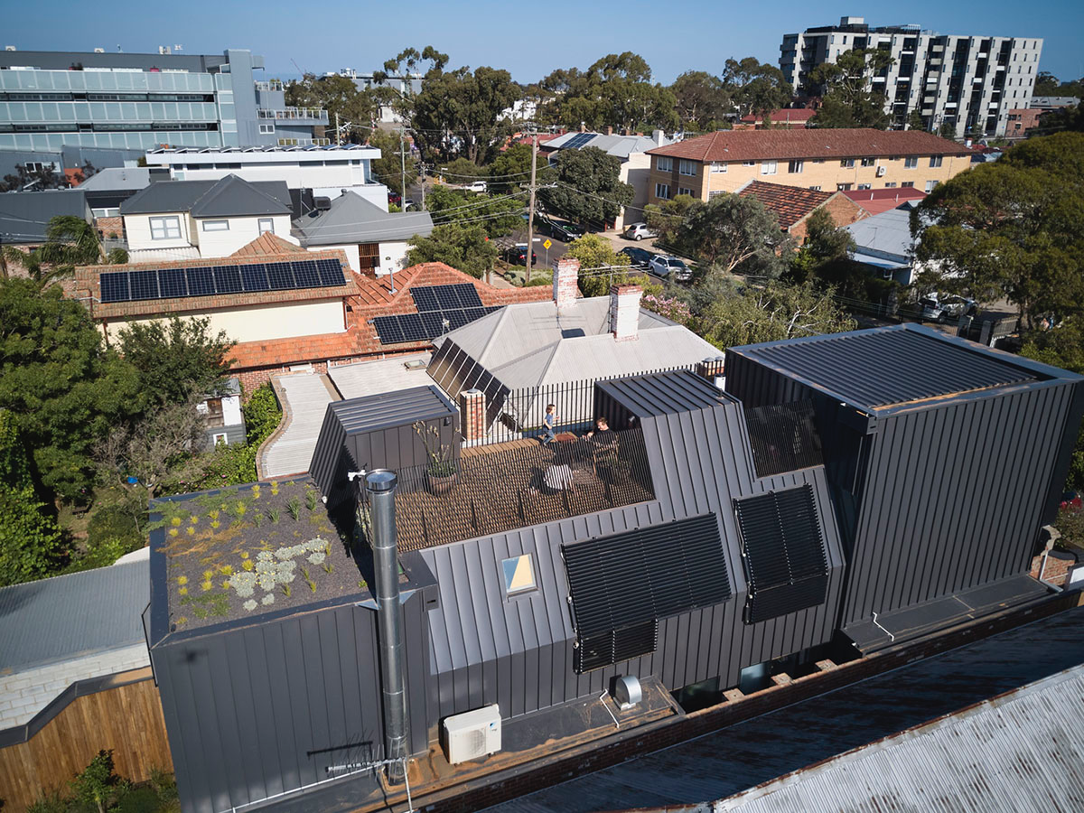 Austin Maynard Architects adds glass volume to the original Dutch-gabled facade in Melbourne