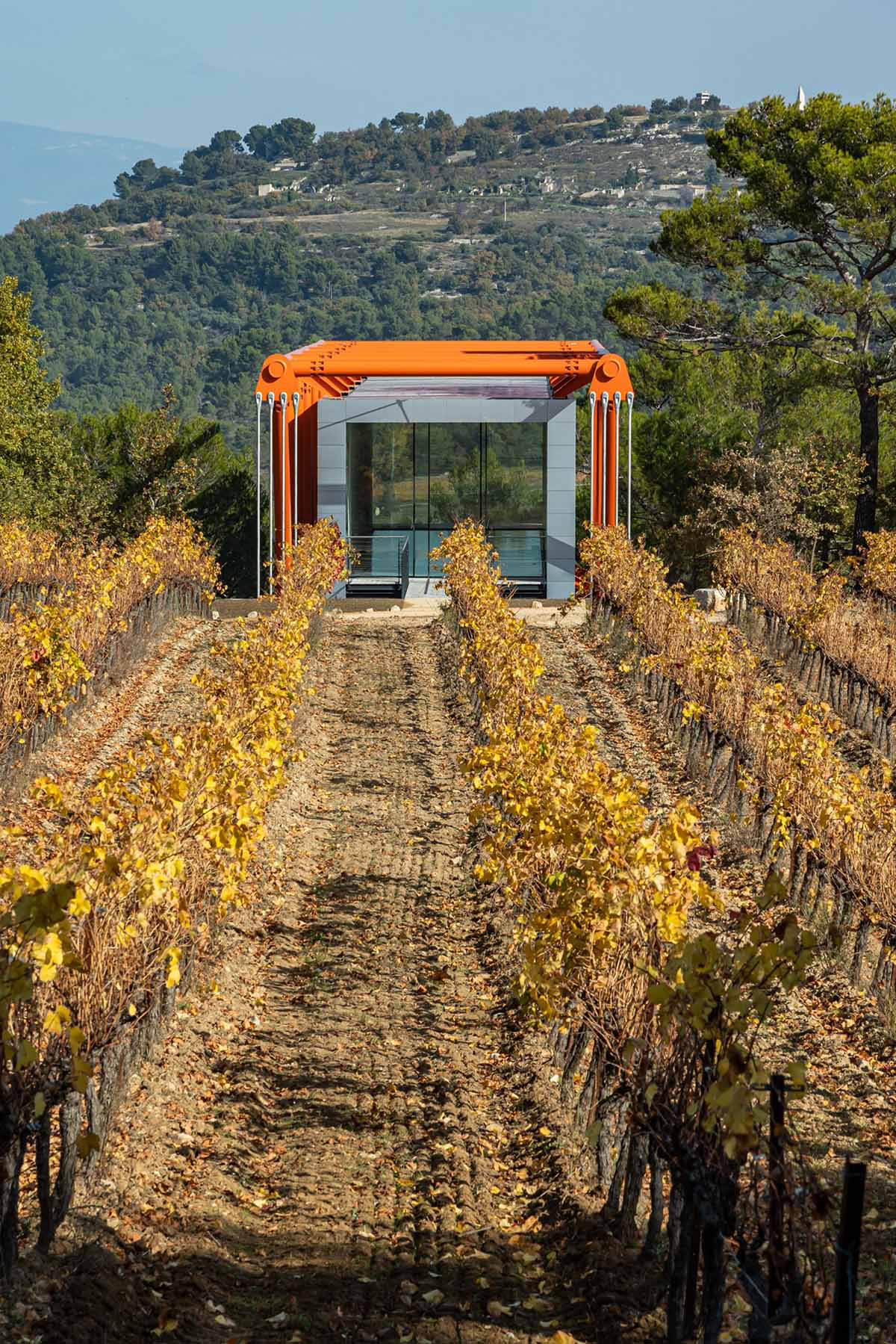 Richard Rogers' new gallery supported by orange steel beams cantilevers out 27 meters over hillside