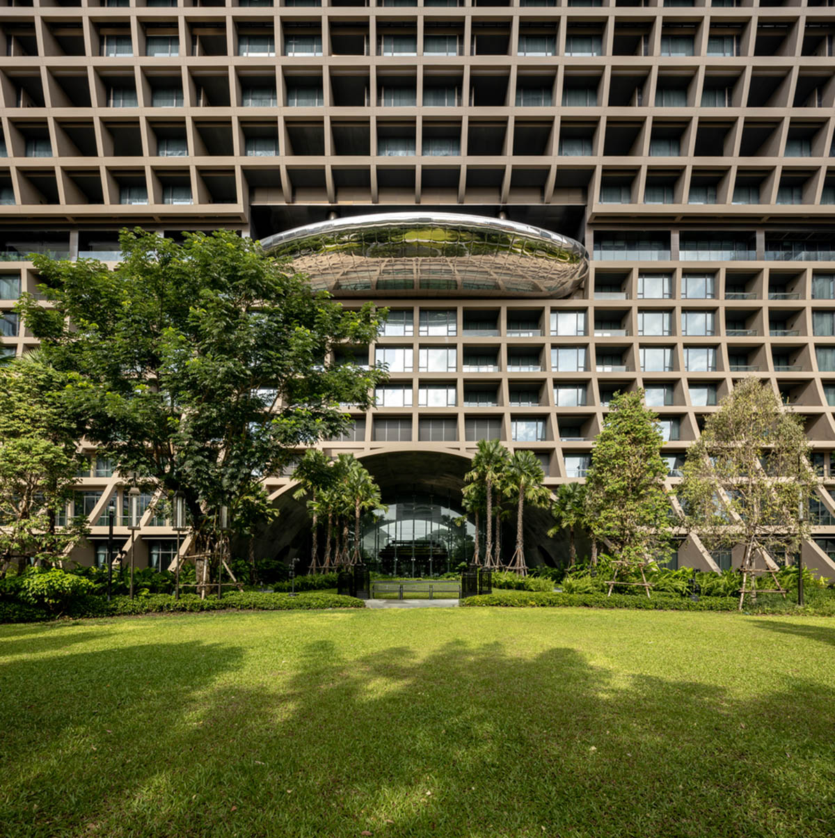 Plan Architect built gridded hotel that features cave-like entrance in Thailand