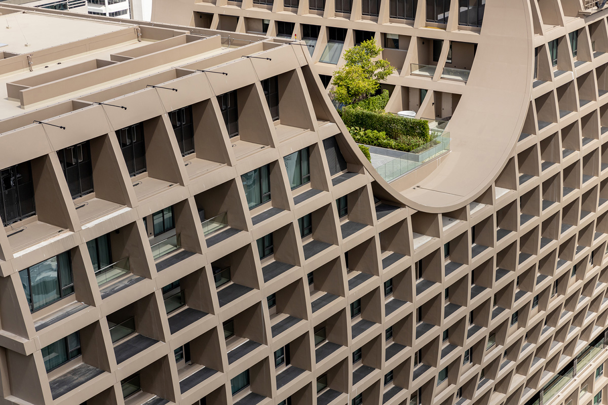 Plan Architect built gridded hotel that features cave-like entrance in Thailand