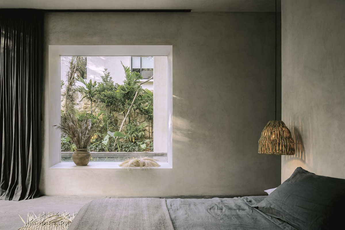 CO-LAB Design Office built concrete villa framing a lush jungle in Tulum